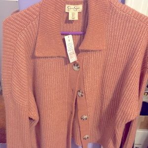 Fuzzy cardigan with buttons the color is like a coral pink